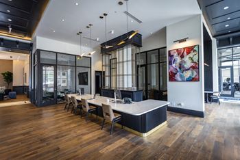 A large open space with a long table and chairs